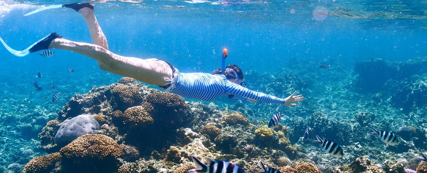 girl enjoying the best snorkeling in the Cayman Islands