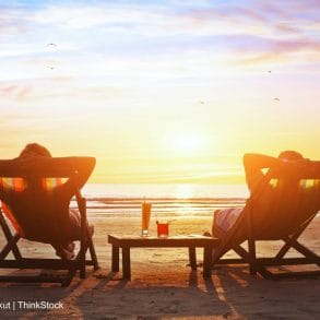 couple enjoying Grand Cayman Beach Bars