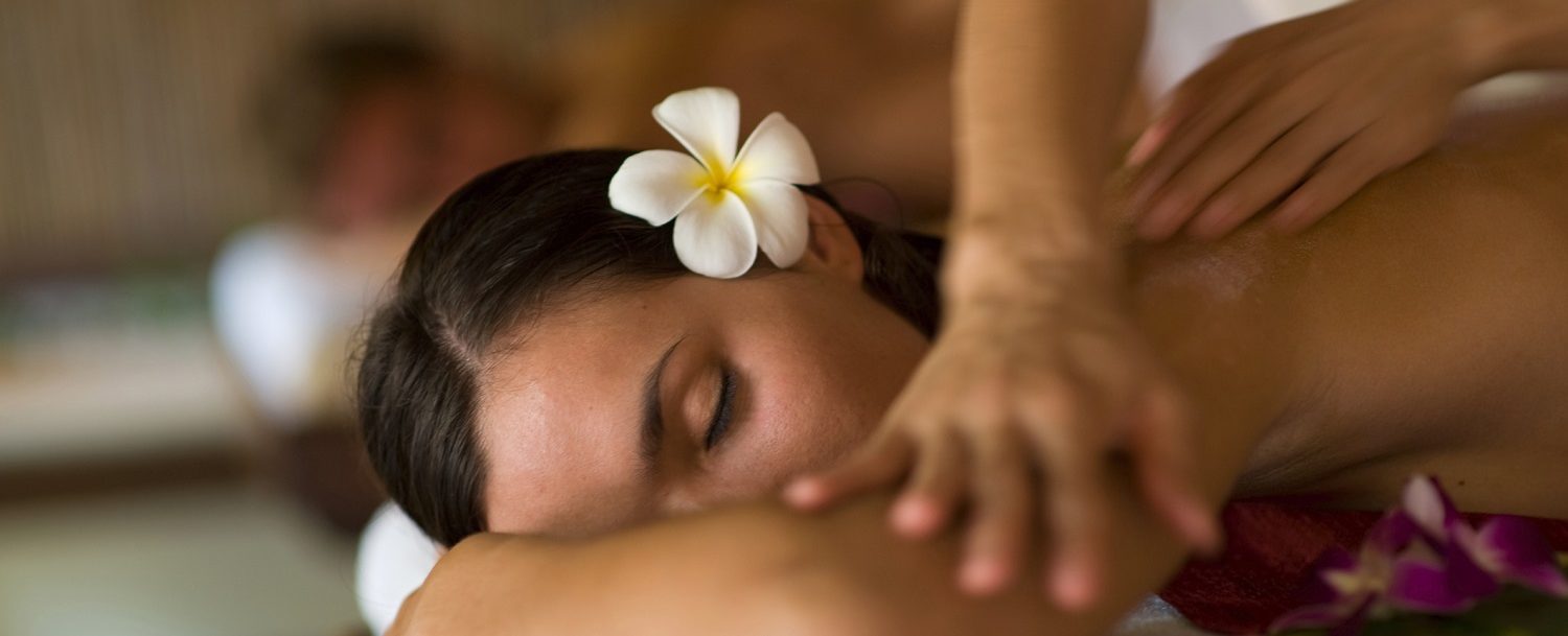 woman enjoying Grand Cayman spa treatment