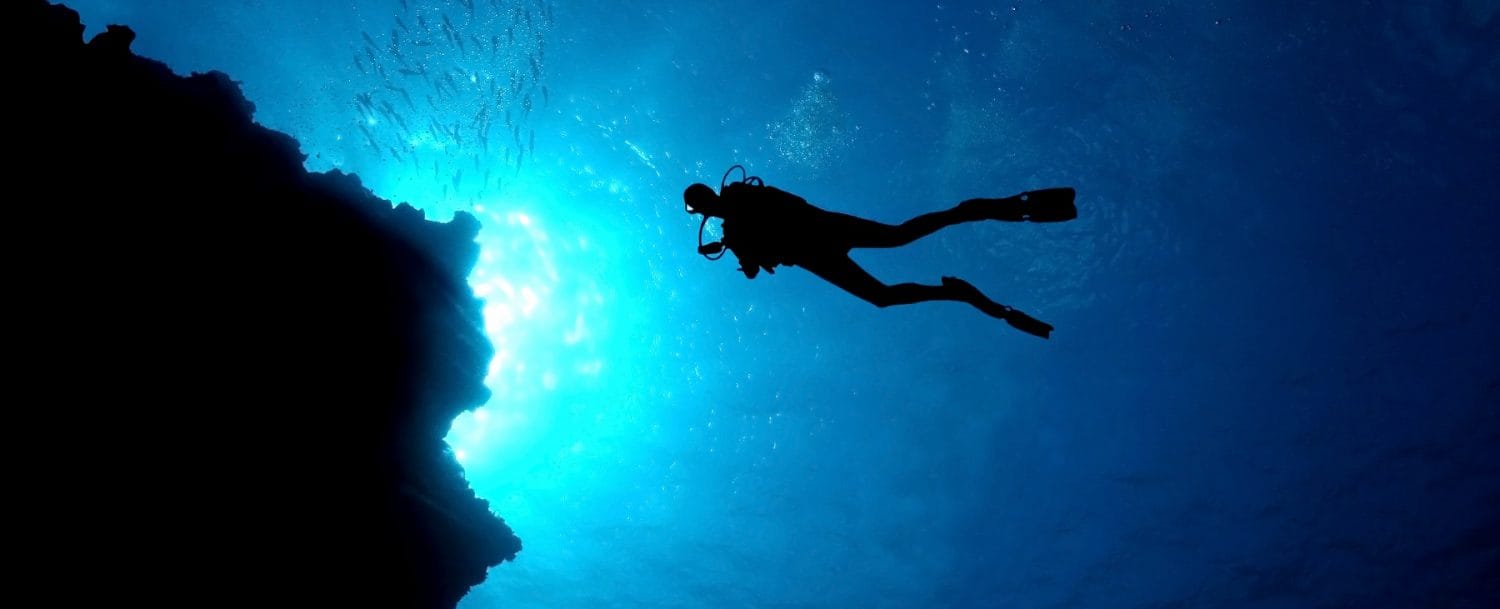 man enjoying shore diving in grand cayman