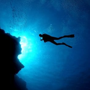 man enjoying shore diving in grand cayman