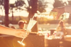 waiter pours champagne