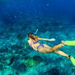 Young woman diving underwater