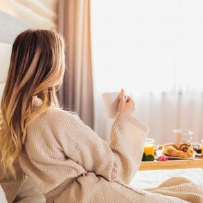 Breakfast in bed, cozy hotel room. concept