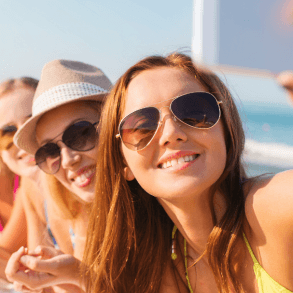 Group of young women taking selfie at the beach