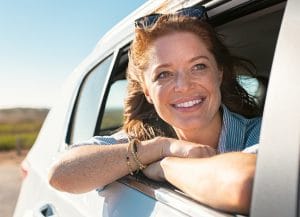 Woman looking outside car window