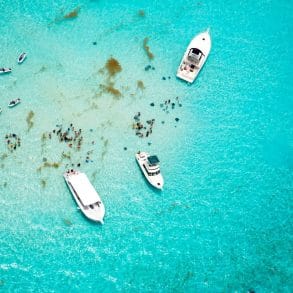 aerial view of stingray city in grand cayman with boats and jet skis