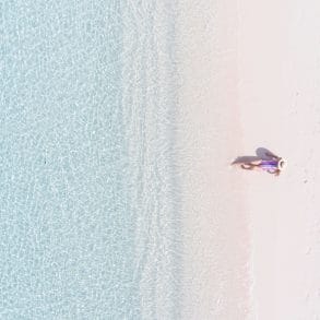 Grand Cayman vs Aruba? This woman choose the beautiful beaches of Grand Cayman.