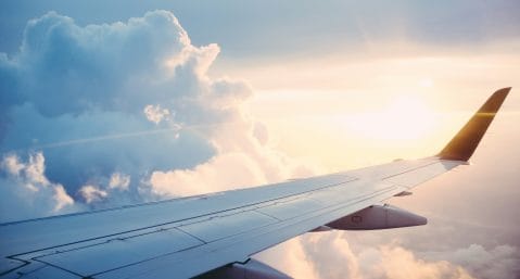 Plane Flying from New York to Grand Cayman