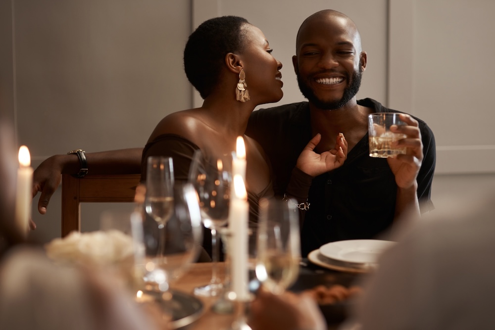 Happy couple in restaurant, party or dinner celebration.